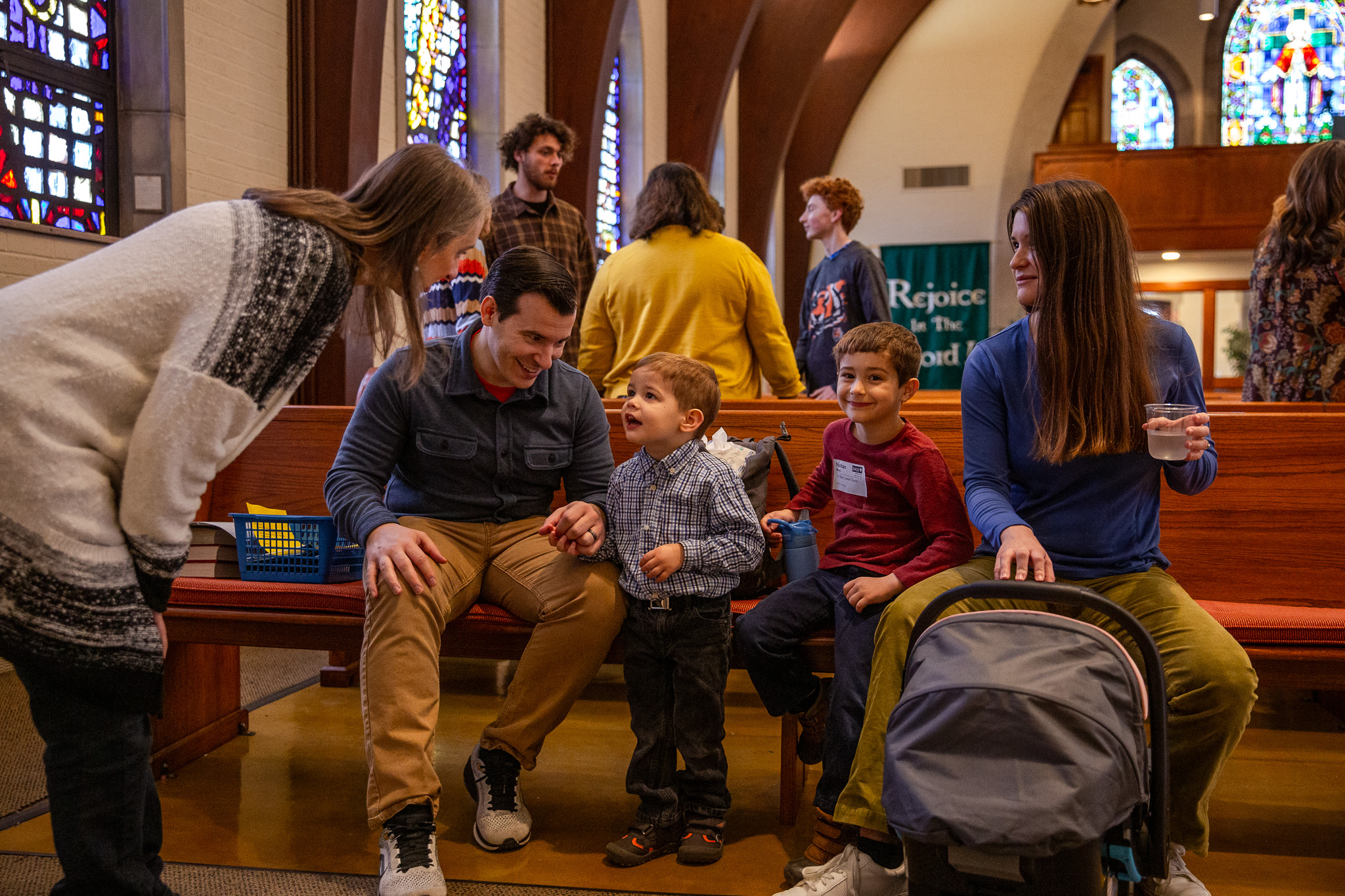 Adults and children gathered together in the Crossroads sanctuary